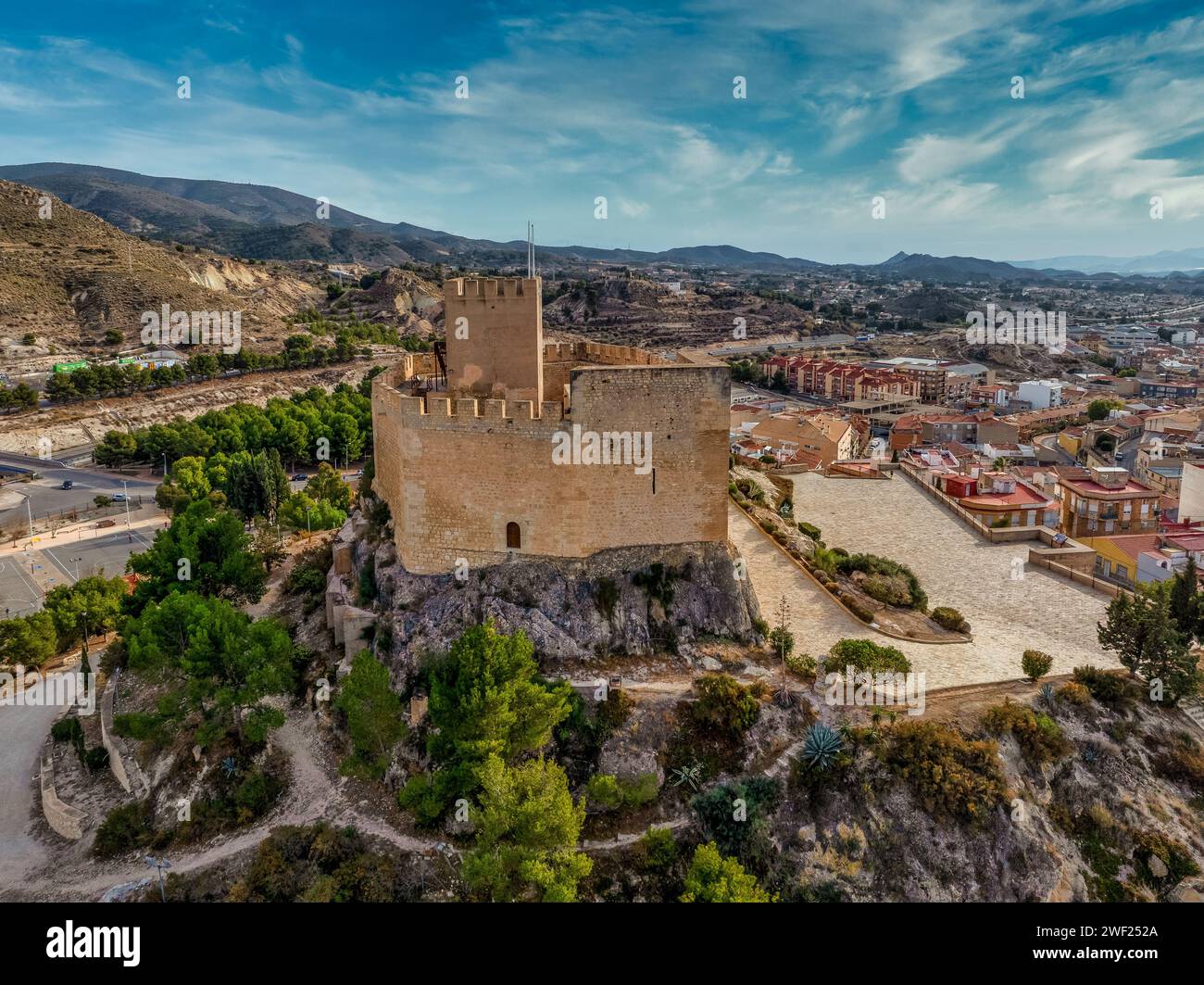 Aerial view of Petrer, medieval town and hilltop castle with restored tower and battlements near Elda Spain, Stock Photo