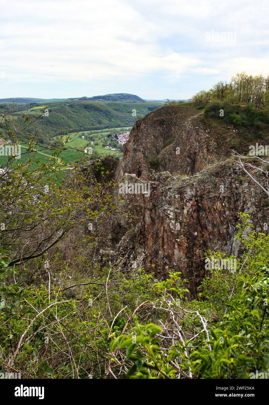Top of cliff in Rotenfels surrounded by plants on a spring day in Rhineland Palatinate, Germany. Stock Photo