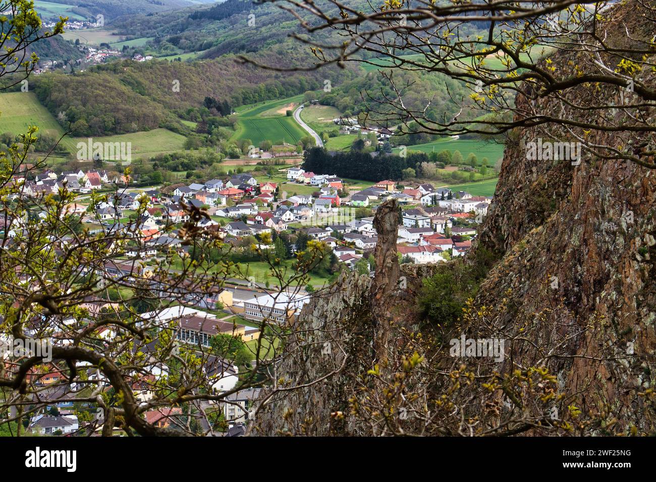 Bad Munster, Germany - May 9, 2021: Trees on the top of Rotenfels overlooking German town in Rhineland Palatinate, Germany. Stock Photo