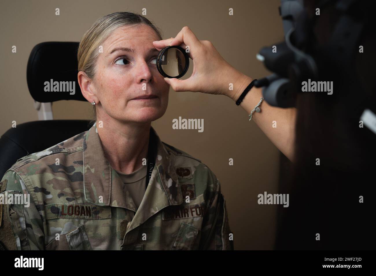 Tampa, Florida, USA. 24th Jan, 2024. Dr. Molly Buchanan, 6th Operational Medical Readiness Squadron optometrist, right, inspects the eyes of U.S. Air Force Col. Catherine Logan, U.S. Central Command manpower and personnel director, at MacDill Air Force Base, Florida, January. 24, 2024. The 6th OMRS optometry clinic provides services for active-duty members assigned to USCENTCOM, U.S. Special Operations Command, the 6th Air Refueling Wing and other tenant units across the installation. (Credit Image: © U.S. Air Force/ZUMA Press Wire) EDITORIAL USAGE ONLY! Not for Commercial USAGE! Stock Photo