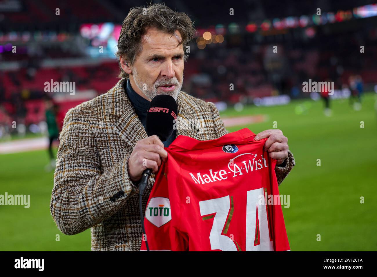 EINDHOVEN, NETHERLANDS - JANUARY 27: Toine van Peperstraten (ESPN) with a special shirt make a wish Speaks with during the Eredivisie match of PSV Ein Stock Photo