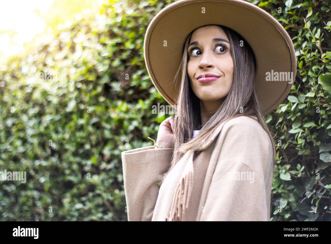 Person in green hat hi-res stock photography and images - Alamy