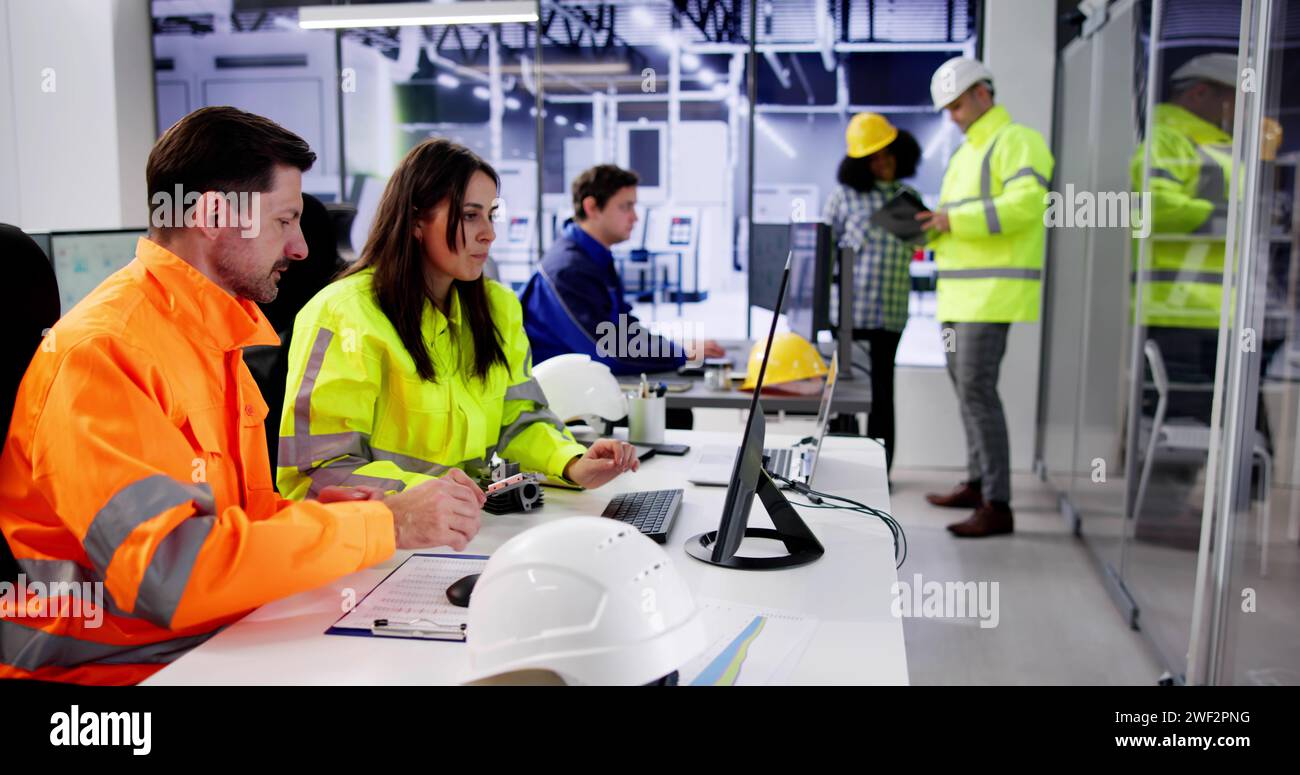 Engineer Operators Using Scada System At Industrial Plant Stock Photo