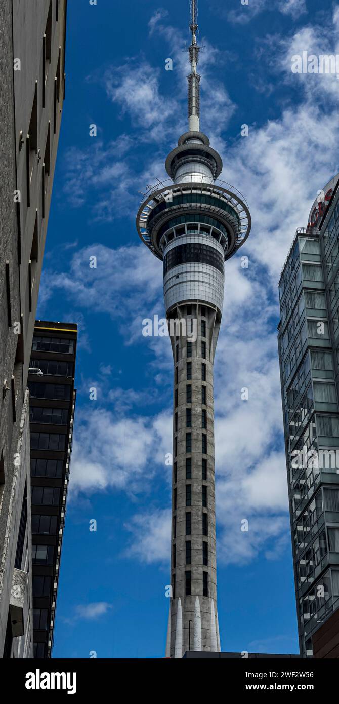 Sky Tower dominates view of Aukland, New Zealand. The top restaurant rotates once every 45 min. Stock Photo
