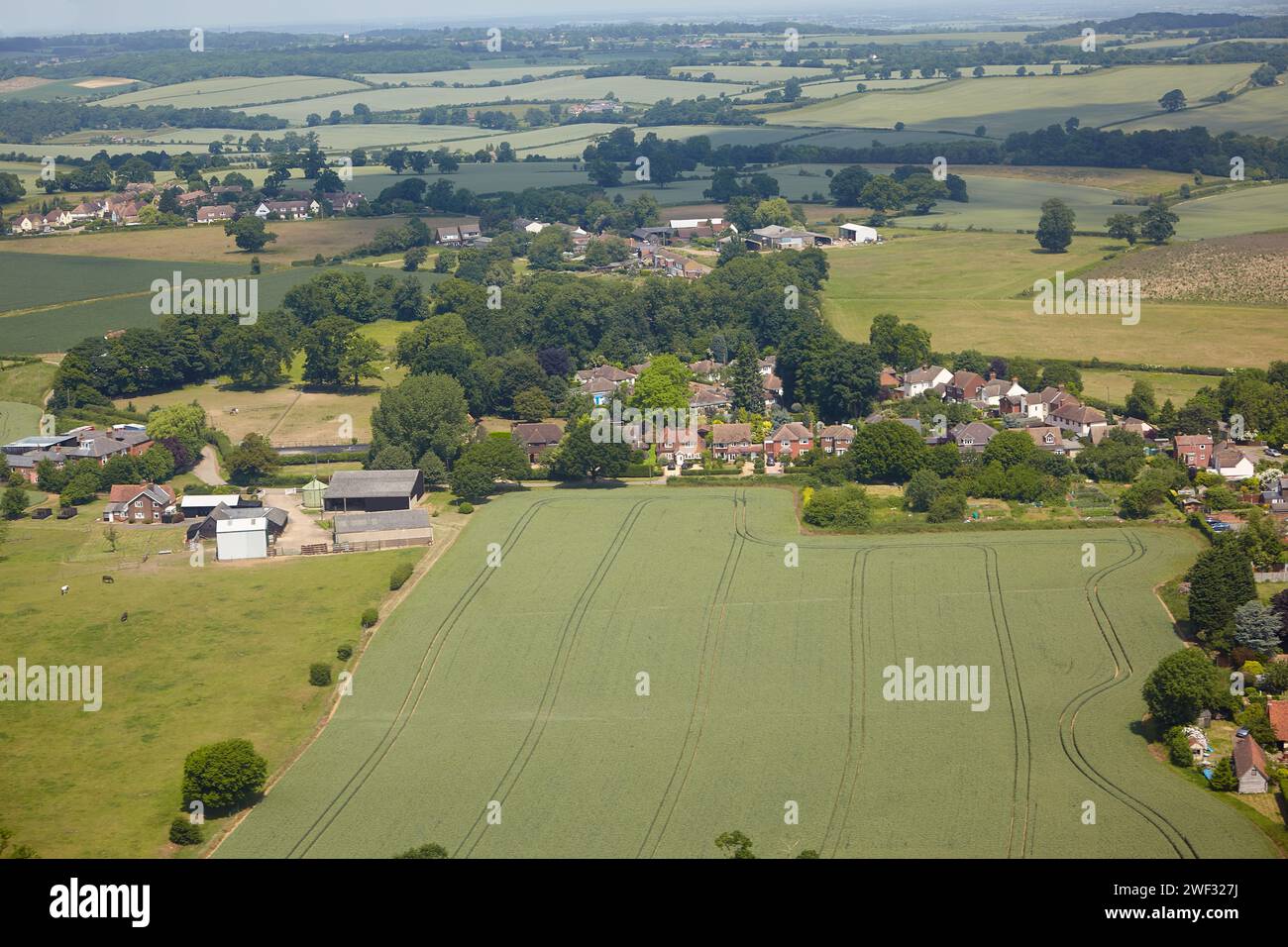 The aerial view of the fields and cousy settlements located in the lowlands surrounding county and university town of Cambridge. Cambridgeshire. Unite Stock Photo