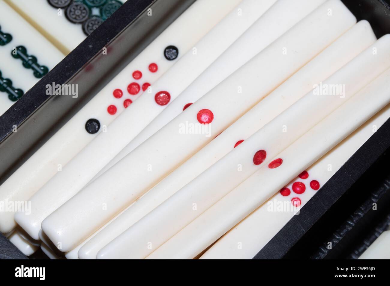 A Mahjong Or mah-jongg Game Pieces and Dice Close Up Stock Photo
