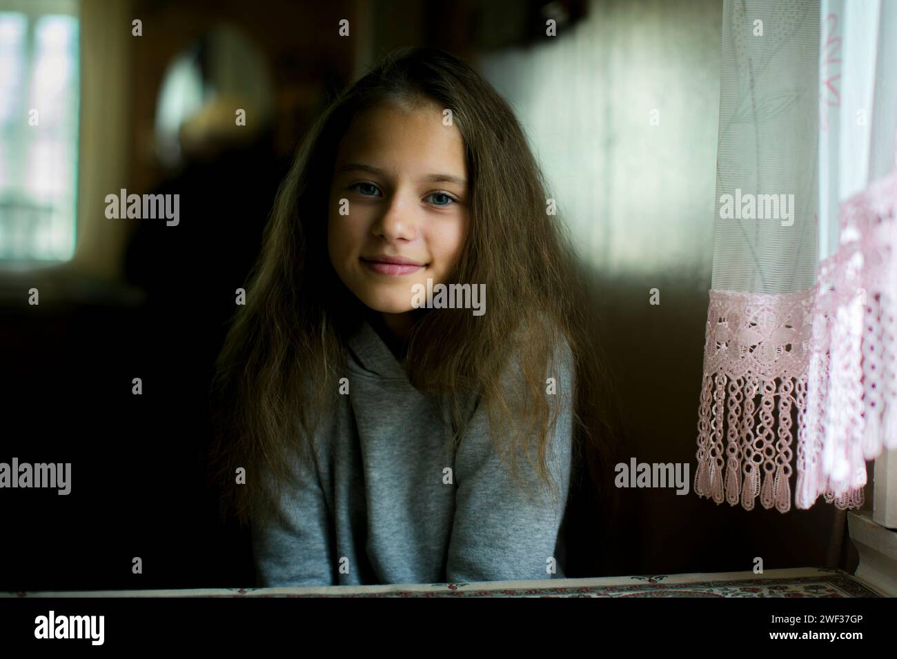 Portrait of a slightly embarrassed teenage girl Stock Photo - Alamy