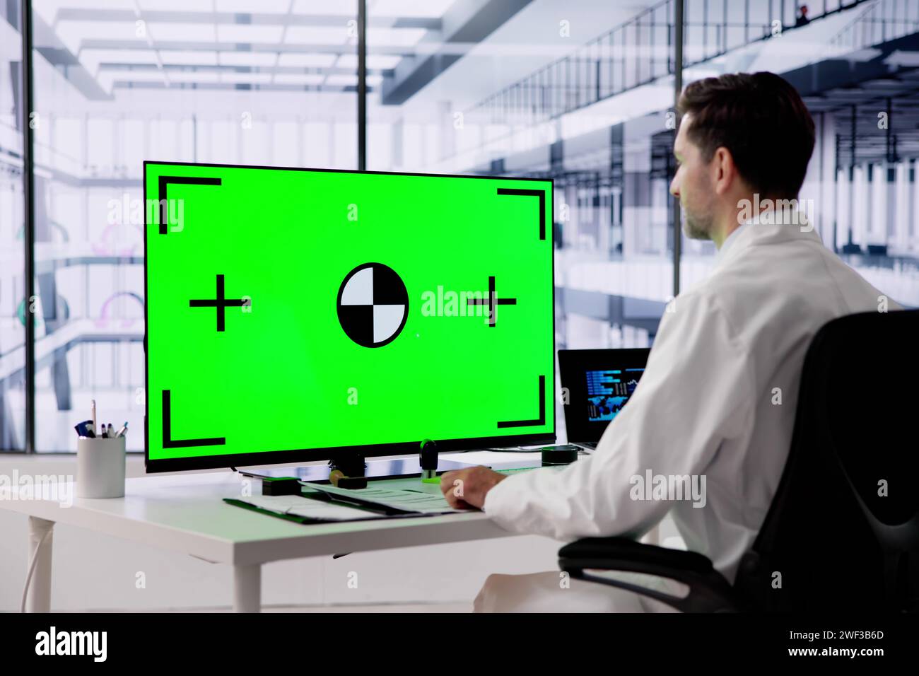 Man using desktop green chroma hi-res stock photography and images - Alamy