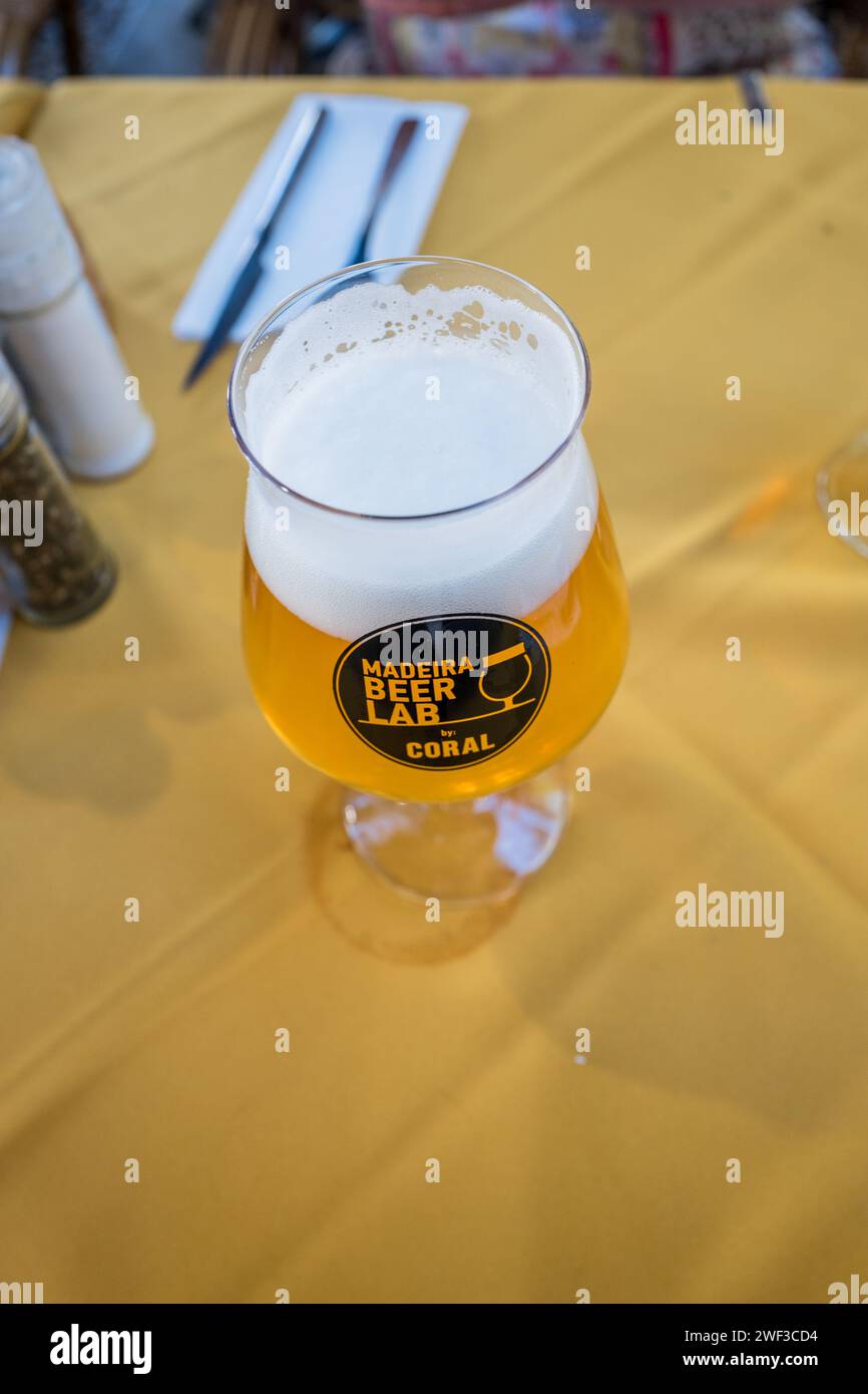 A cool drink of Madeira Beer Lab Weiss Banana beer at a restauant in the Maderira city of Funchal. Stock Photo