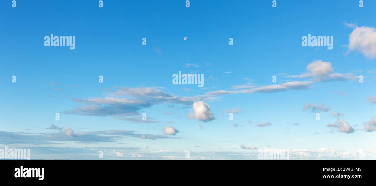 Cloudscape - Blue sky and white clouds, wide panorama Stock Photo - Alamy
