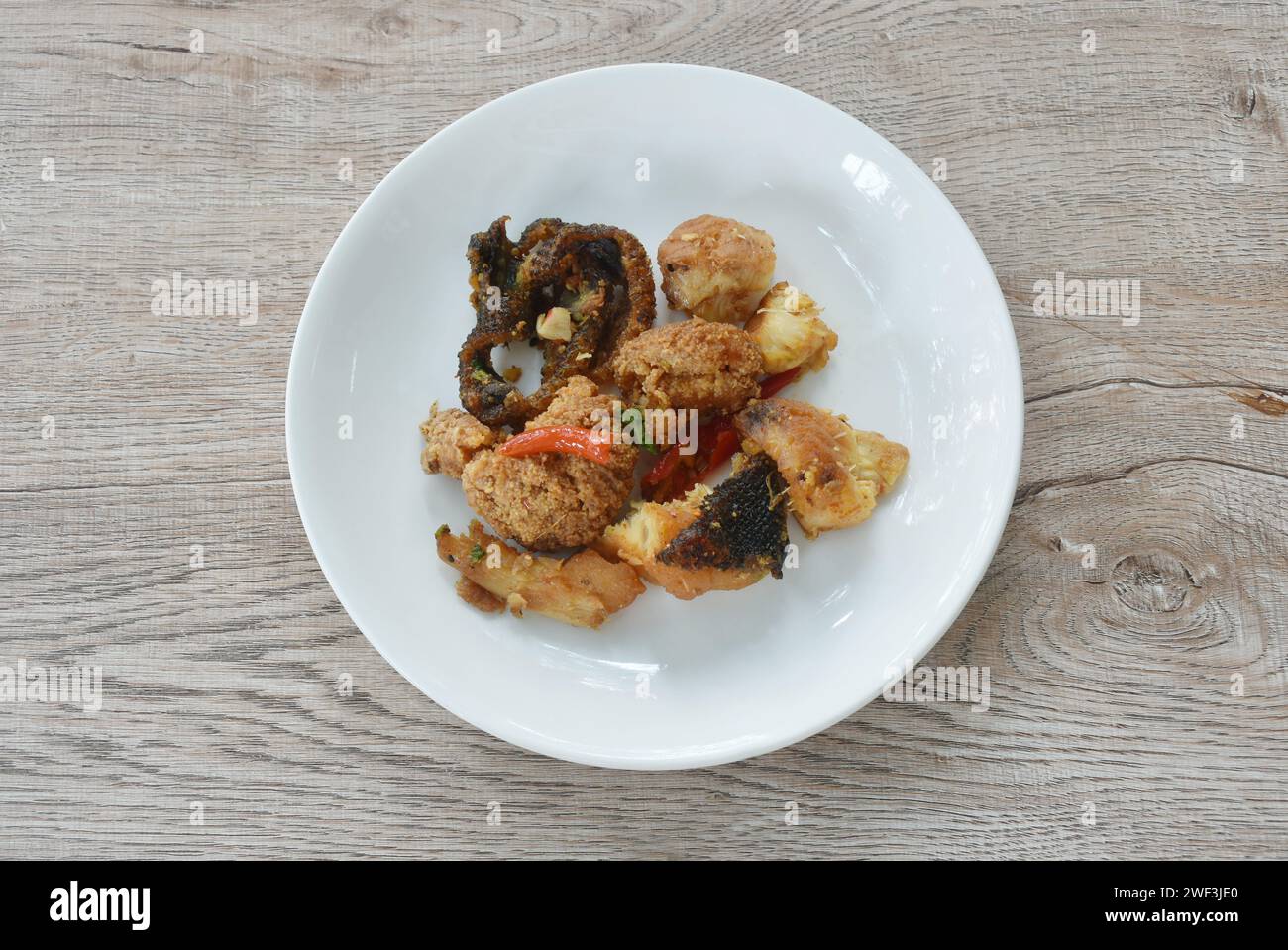 deep fried slice common silver barb fish with chili sweet vinegar on plate Stock Photo