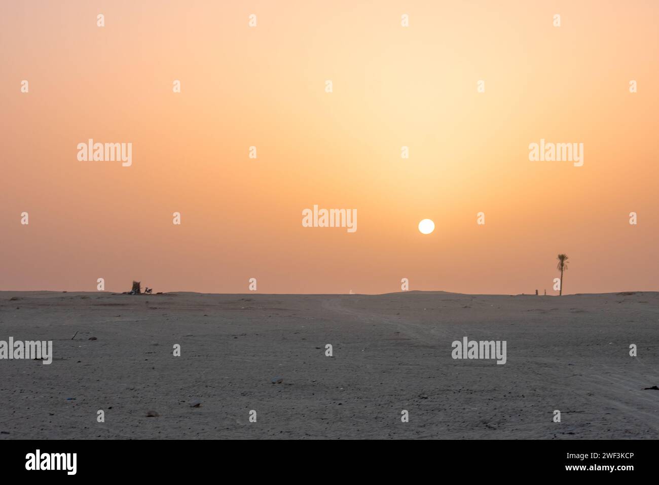 Beautiful sunset over Sahara desert in Douz, Tunisia. Sand and dunes against sky Stock Photo