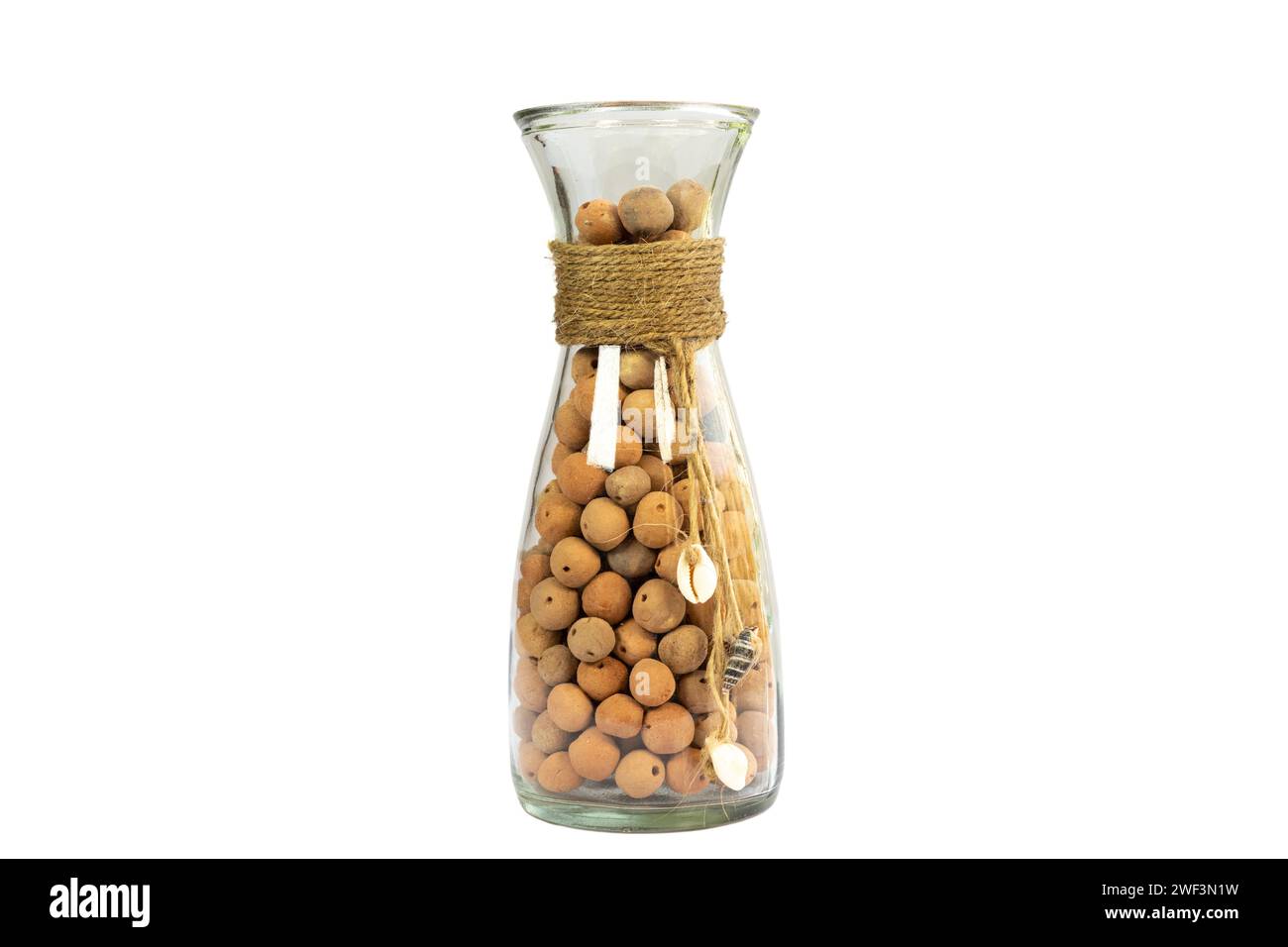 Leca Clay balls in a sleek glass bottle vase isolated on white