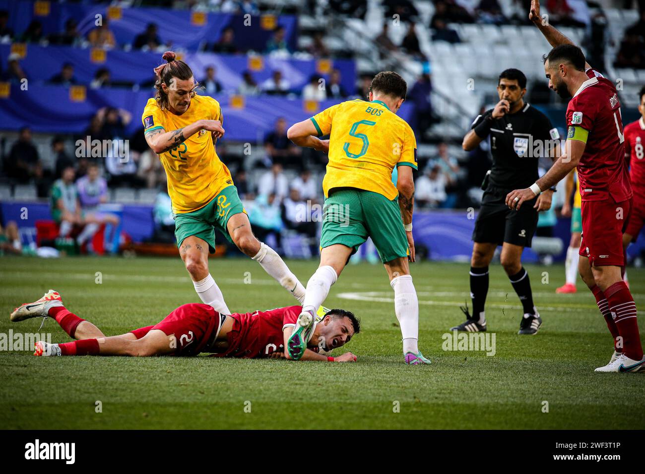 Doha, Qatar, 28 Jan 2024, AFC Asian Cup Qatar 2023 Round of 16  - Australia 4:0 Indonesia, Jackson Irvine and Jordan Bos tackelling Stock Photo