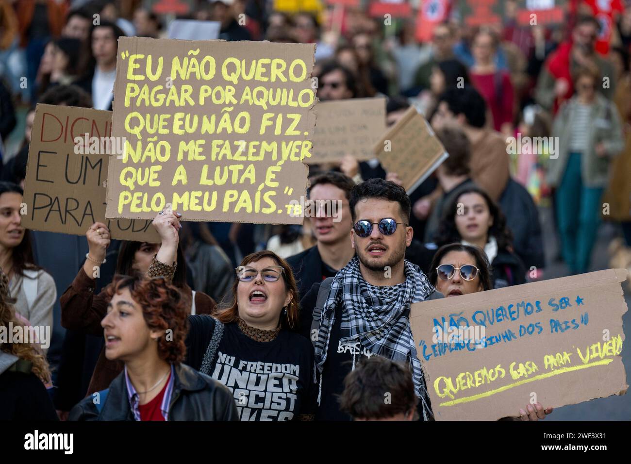 Protesters chant slogans while holding placards during the demonstration. In Portugal, 19 cities demonstrated in order to defense the right to housing, due to the disproportionate increase in the price of housing, the few possibilities to obtain a fair house rent, the real estate crisis that is shaking the country and the little resolution that the government is giving to these situations. This event was organized by the platform Casas para Viver (houses to live in) which brings together all the collectives of social struggle in favor of decent housing. (Photo by Jorge Castellanos/SOPA Image Stock Photo