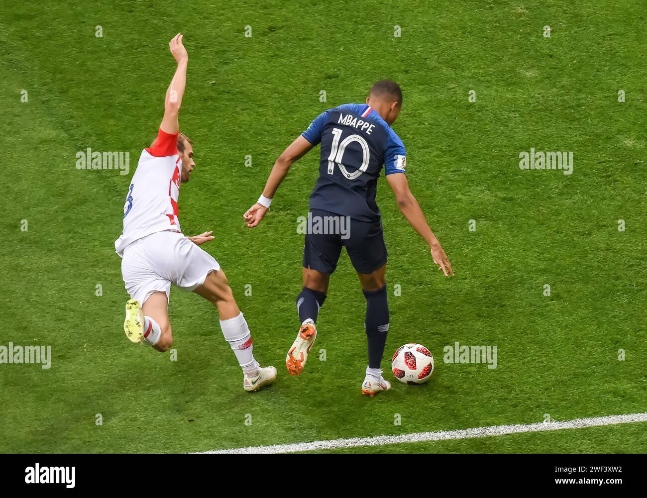 Moscow, Russia – July 15, 2018. Croatia national football team left-back Ivan Strinic and France striker Kylian Mbappe during World Cup 2018 final mat Stock Photo