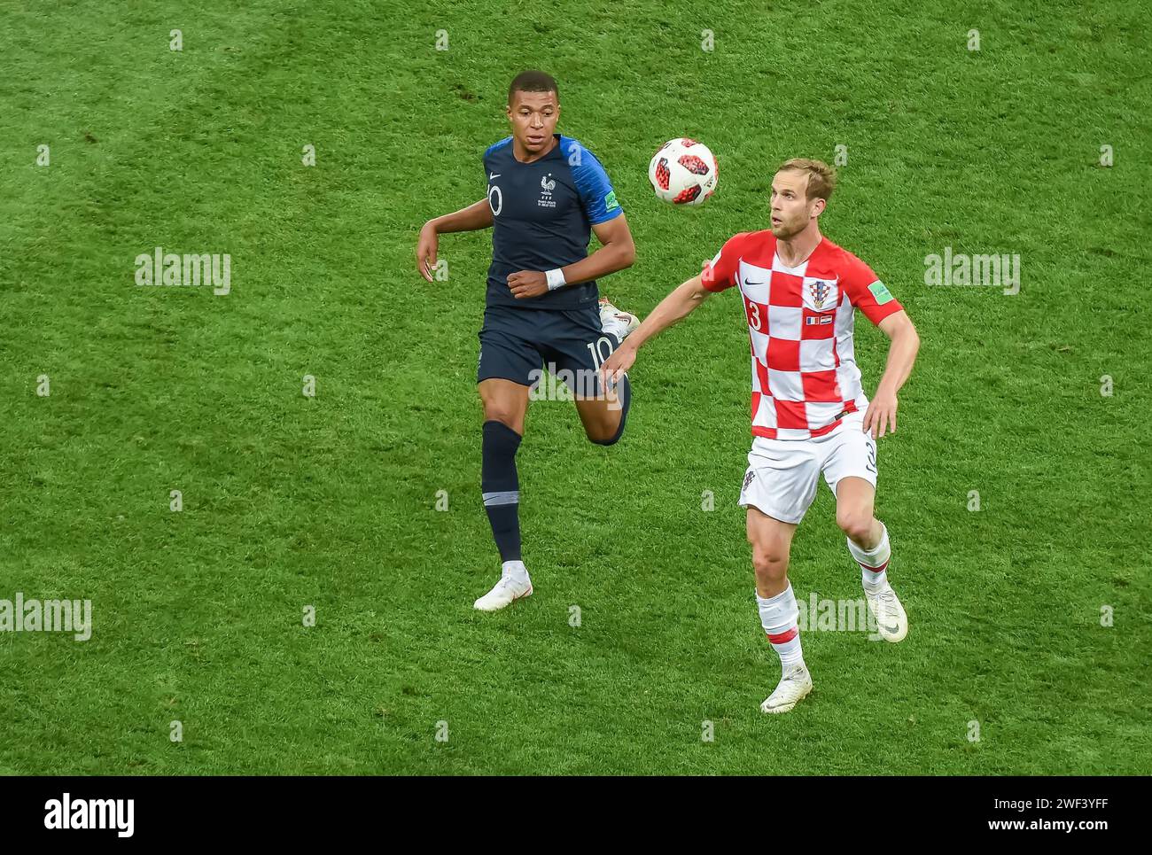 Moscow, Russia – July 15, 2018. France national football team striker Kylian Mbappe and Croatia left-back Ivan Strinic during World Cup 2018 final mat Stock Photo