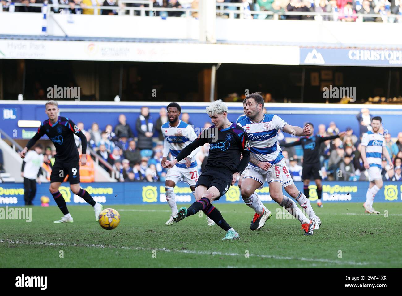 Huddersfield Town's Jack Rudoni (centre left) scores their side's first ...