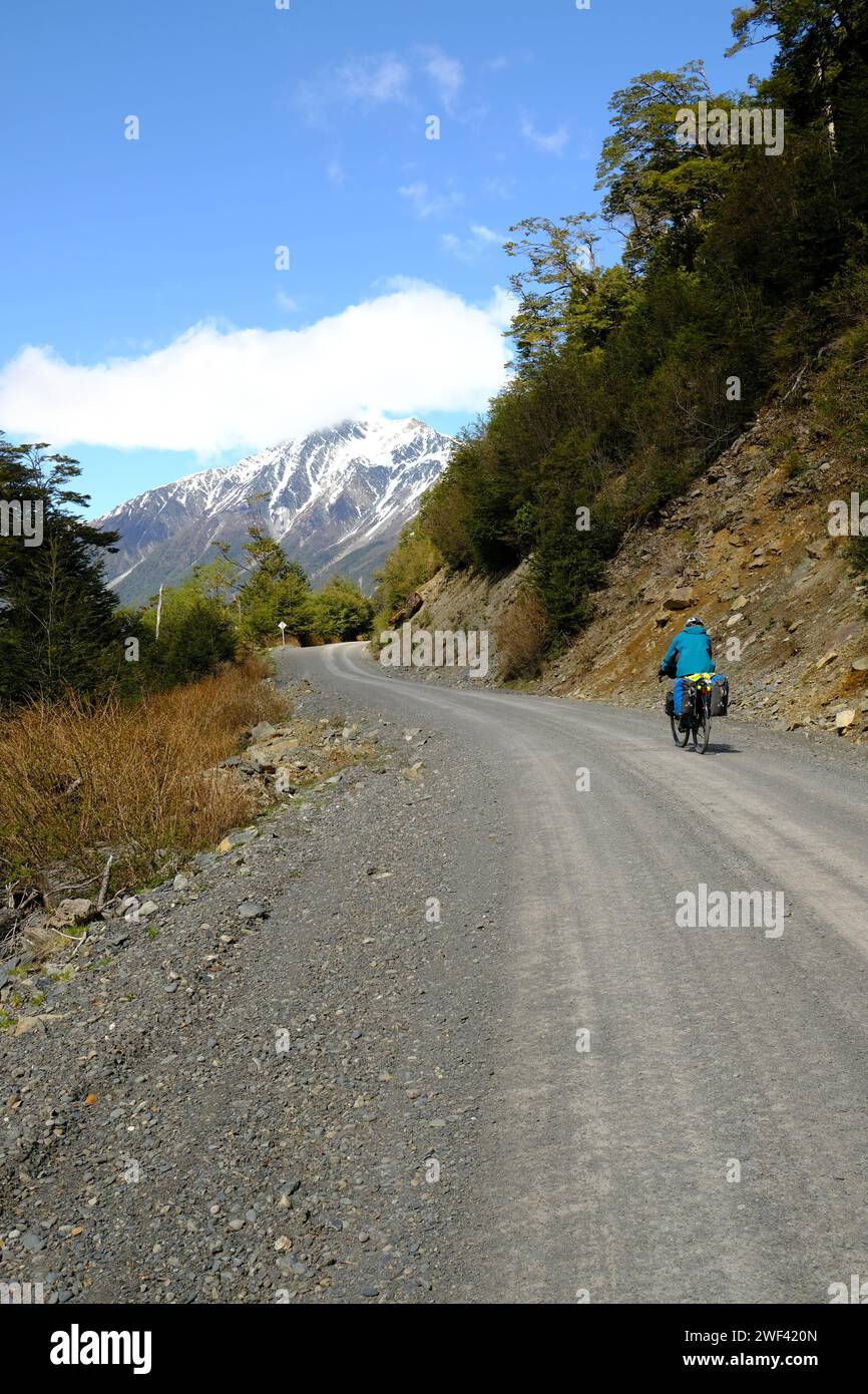 A cyclist rides along the wild southern section of the Carretera Austral near Villa O'Higgins. Stock Photo