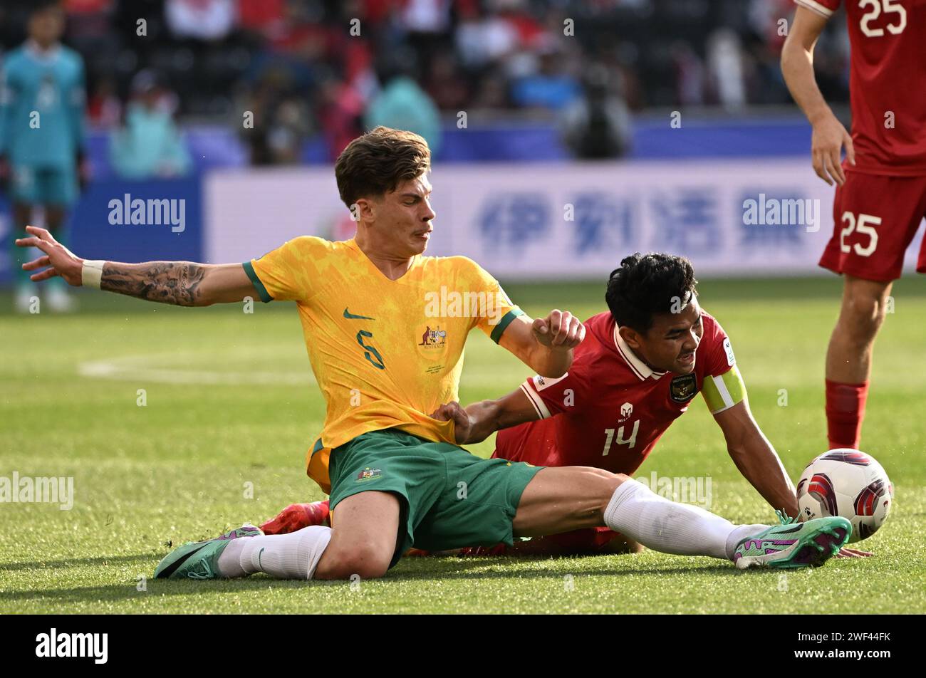 Doha, Qatar. 28th Jan, 2024. Jordan Bos (L) of Australia competes during the round of 16 match between Australia and Indonesia at AFC Asian Cup Qatar 2023 in Doha, Qatar, Jan. 28, 2024. Credit: Sun Fanyue/Xinhua/Alamy Live News Stock Photo