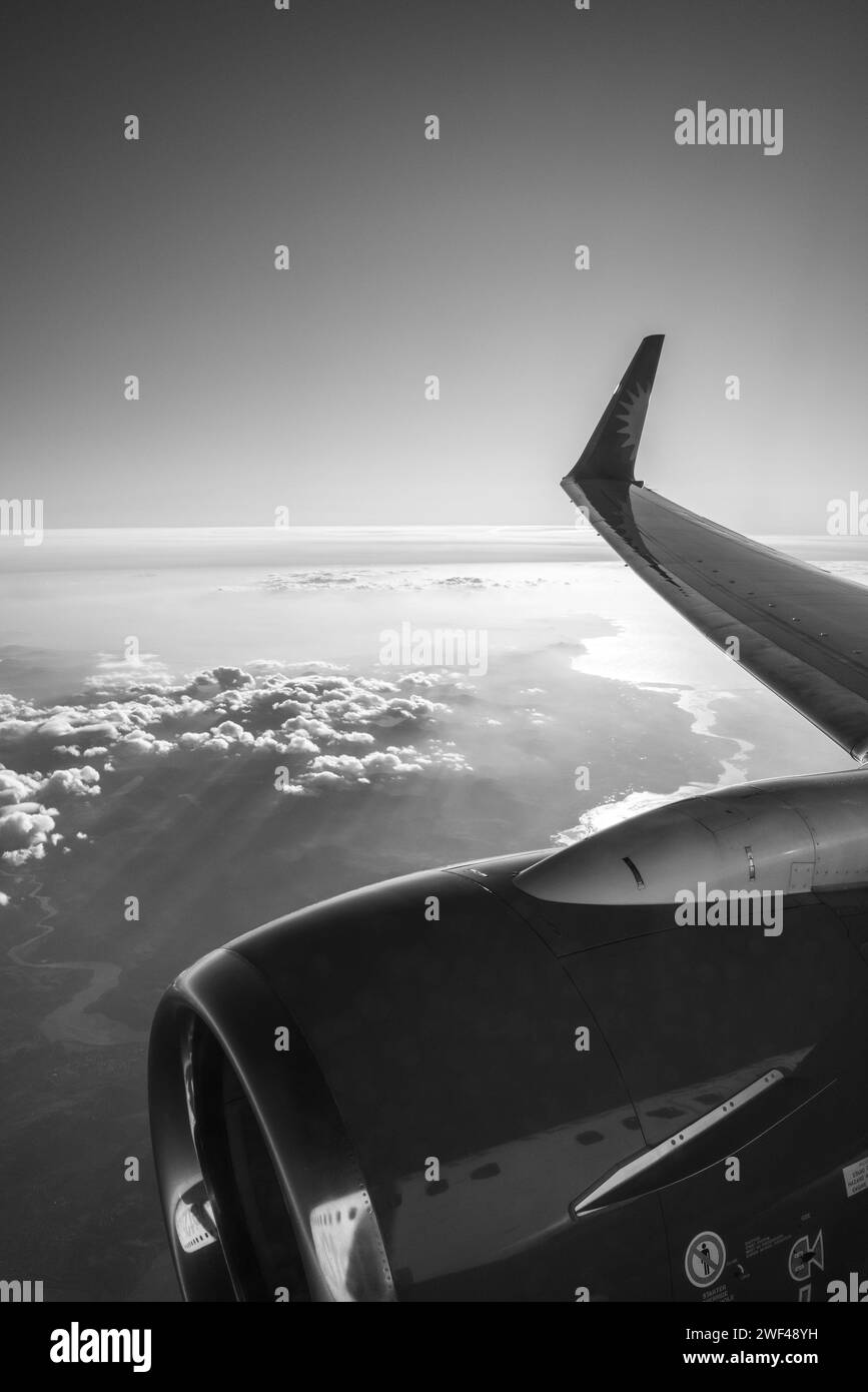 Jet2 Boeing 737-800 passenger jet wing and CFM56-7B engine in-flight over North Wales at sunset. Stock Photo