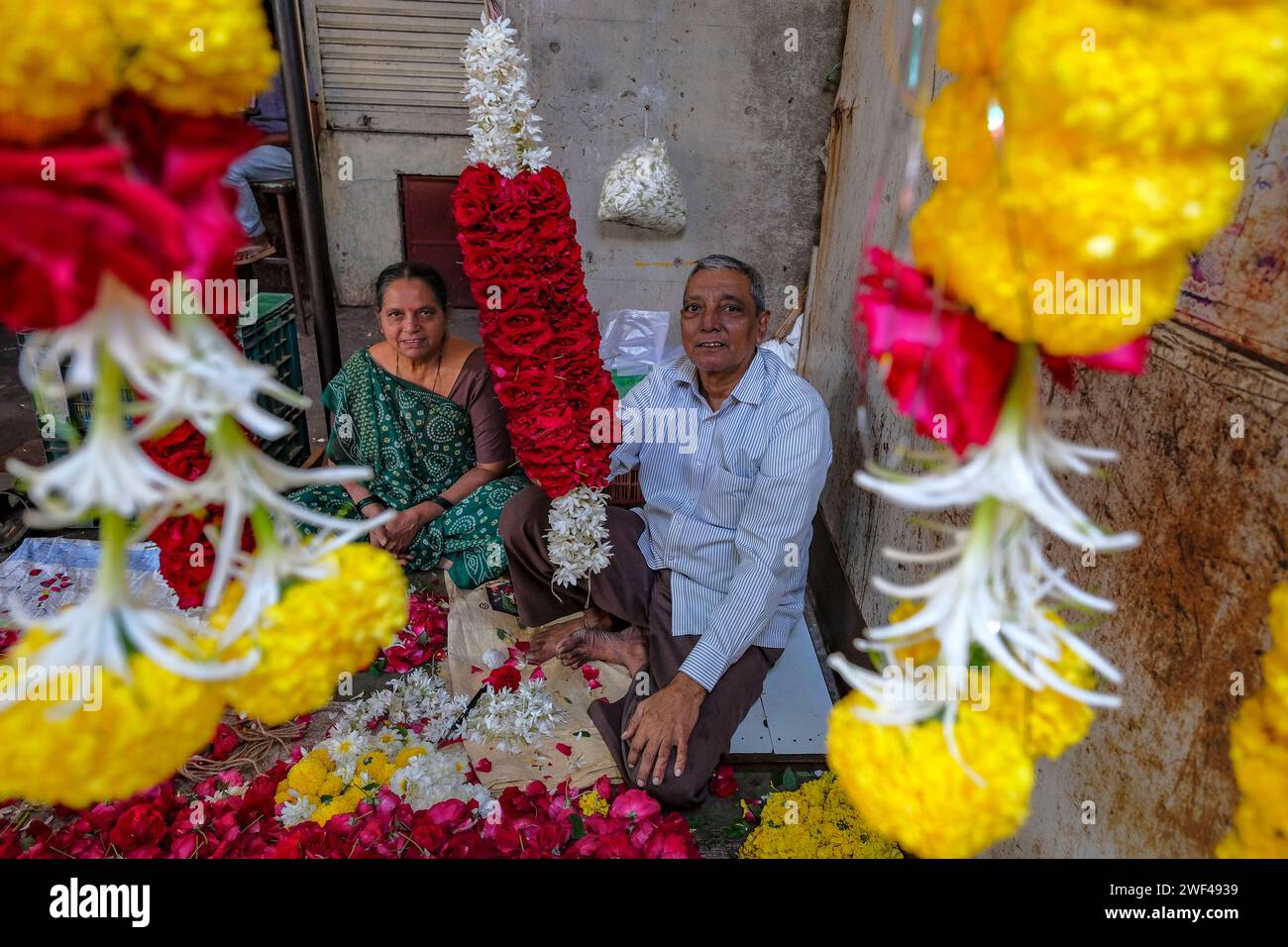 Vadodara, India January 14, 2024 A couple selling flowers at the