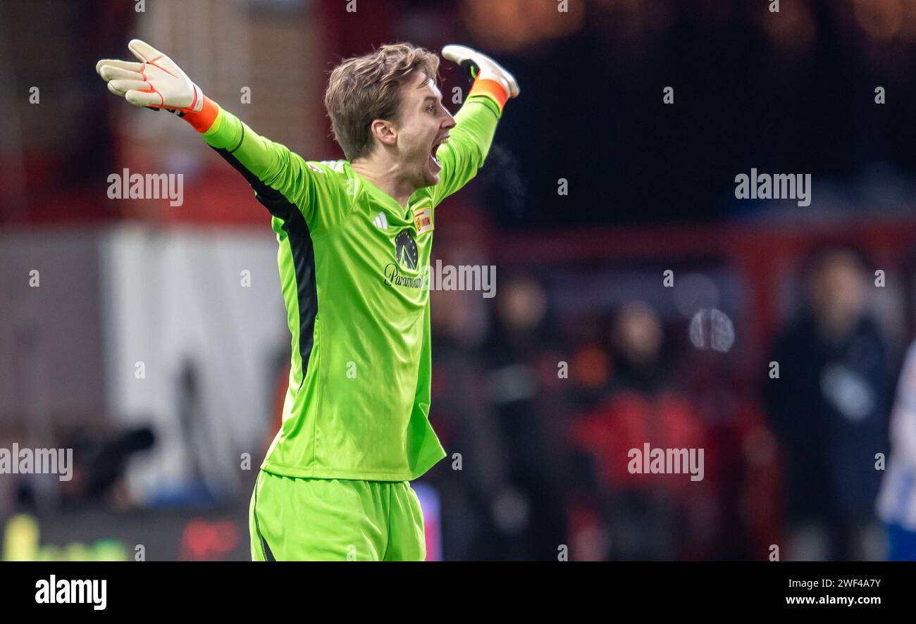 Berlin, Germany. 28th Jan, 2024. Soccer: Bundesliga, 1. FC Union Berlin - Darmstadt 98, Matchday 19, An der Alten Försterei. Berlin goalkeeper Frederik Rönnow celebrates. Credit: Andreas Gora/dpa - IMPORTANT NOTE: In accordance with the regulations of the DFL German Football League and the DFB German Football Association, it is prohibited to utilize or have utilized photographs taken in the stadium and/or of the match in the form of sequential images and/or video-like photo series./dpa/Alamy Live News Stock Photo