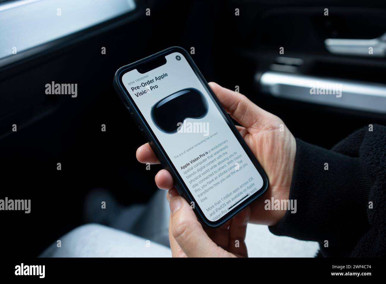 Advertising for pre-ordering Apple Vision Pro is seen in the App Store on an iPhone on January 23, 2024. Apple Vision Pro is Apple's first 3D camera. Stock Photo