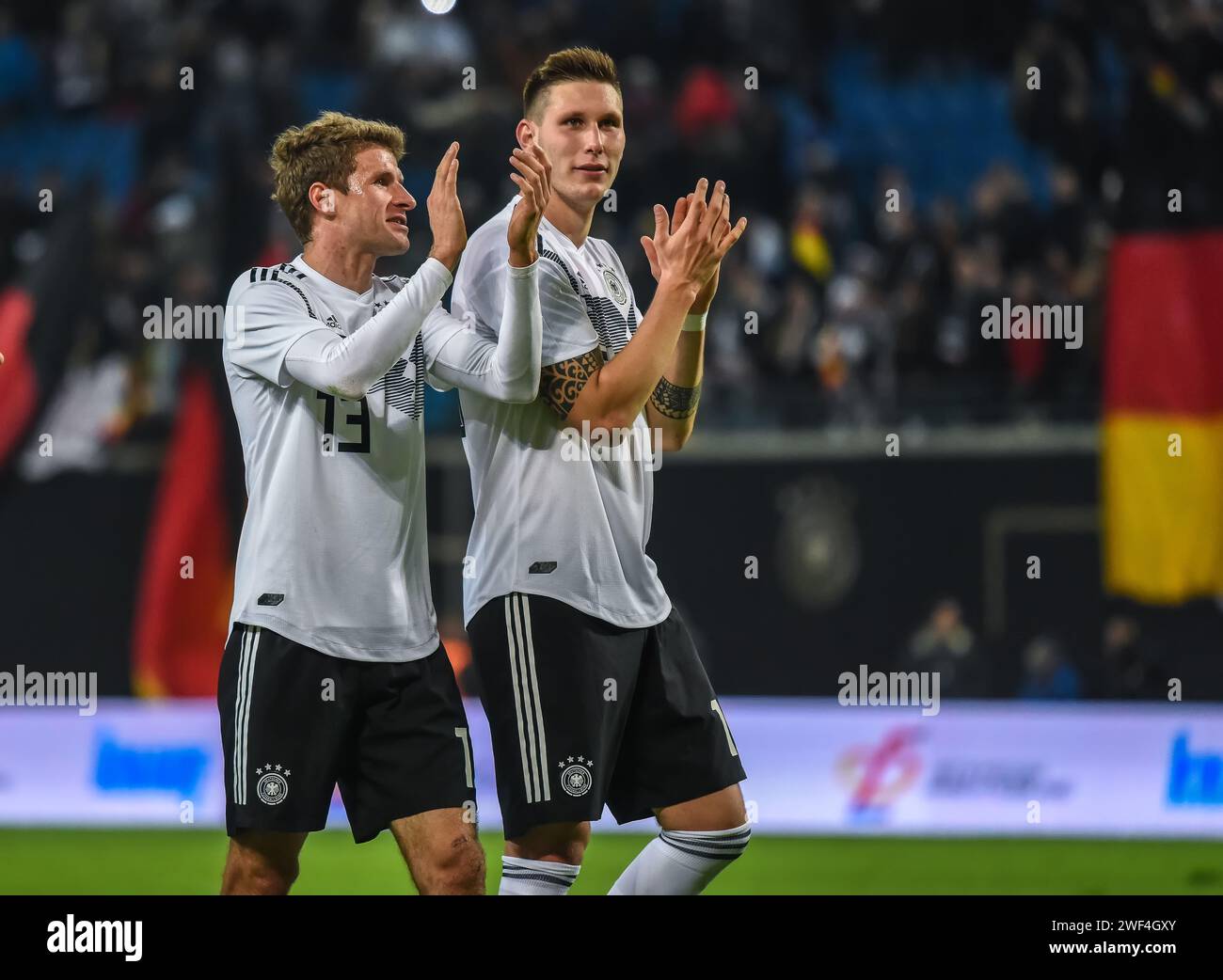 Leipzig, Germany – November 15, 2018. Germany national football team players Thomas Muller and Niklas Sule celebrating victory in during international Stock Photo