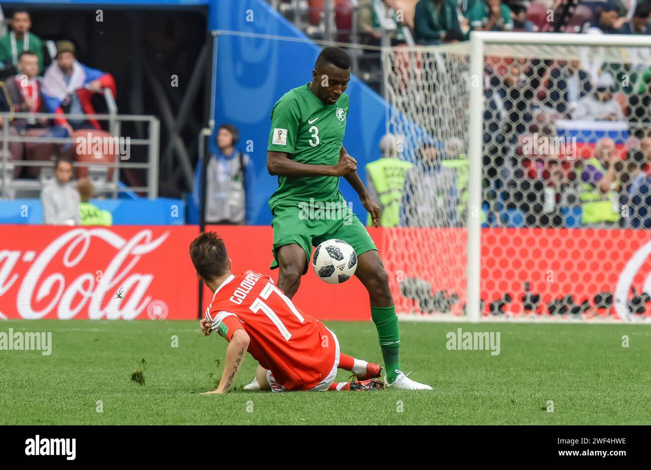 Moscow, Russia – June 14, 2018. Saudi Arabia national football team defender Osama Hawsawi against Russia player Aleksandr Golovin during opening matc Stock Photo