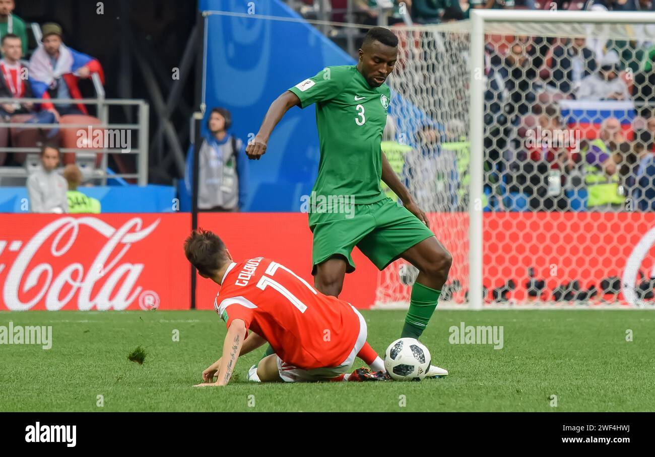 Moscow, Russia – June 14, 2018. Saudi Arabia national football team defender Osama Hawsawi against Russia player Aleksandr Golovin during opening matc Stock Photo