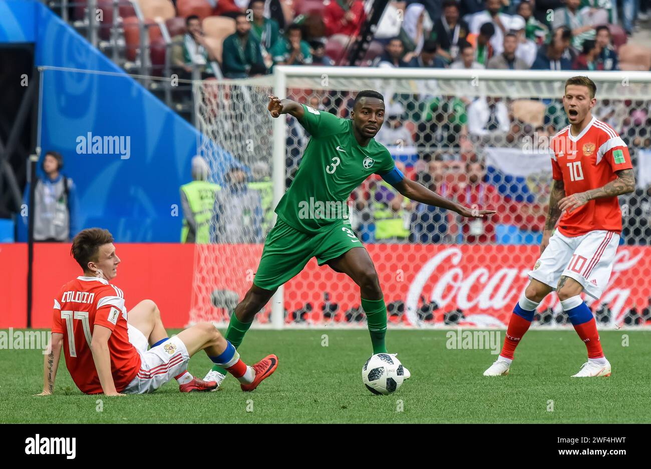 Moscow, Russia – June 14, 2018. Saudi Arabia national football team defender Osama Hawsawi against Russia player Aleksandr Golovin during opening matc Stock Photo