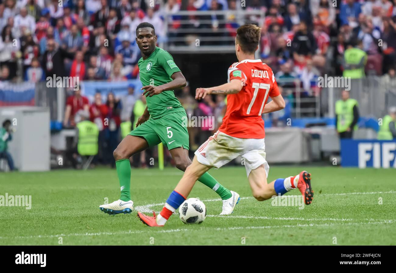 Moscow, Russia – June 14, 2018. Saudi Arabia national football team defender Omar Hawsawi against Russia player Aleksandr Golovin during opening match Stock Photo