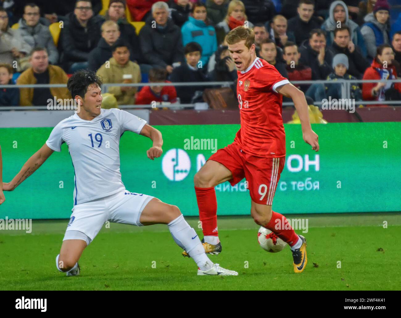 Moscow, Russia – October 7, 2017. South Korea centre-back Kim Young-Gwon and Russia striker Alexander Kokorin during international friendly match Russ Stock Photo