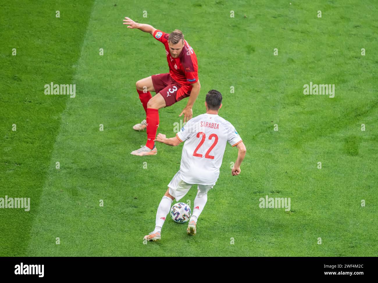 Saint Petersburg, Russia – July 2, 2021. Switzerland right-back Silvan Widmer against Spain striker Pablo Sarabia during EURO 2020 quarterfinal Switze Stock Photo