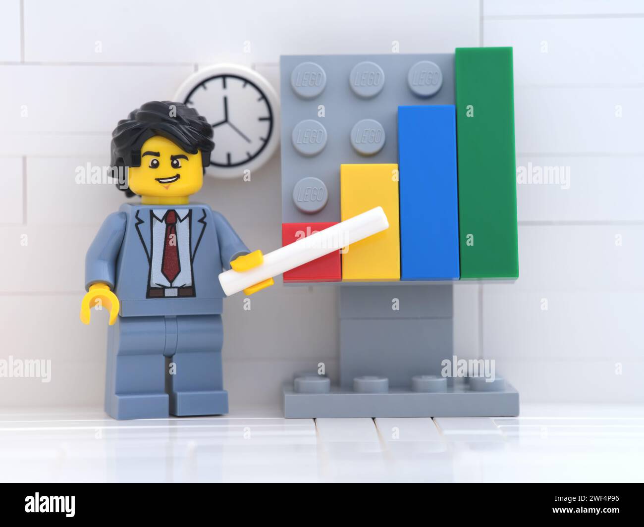Tambov, Russian Federation - January 27, 2024 A Lego businessman minifigure pointing out company growth on a chart. Stock Photo