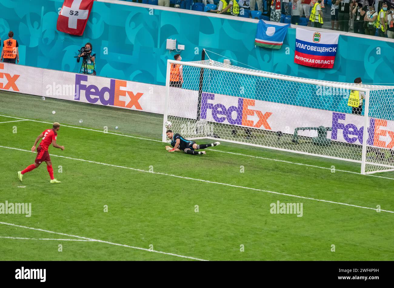 Saint Petersburg, Russia – July 2, 2021. Spain goalkeeper Unai Simon denying a penalty from Switzerland defender Manuel Akanji during penalty shootout Stock Photo
