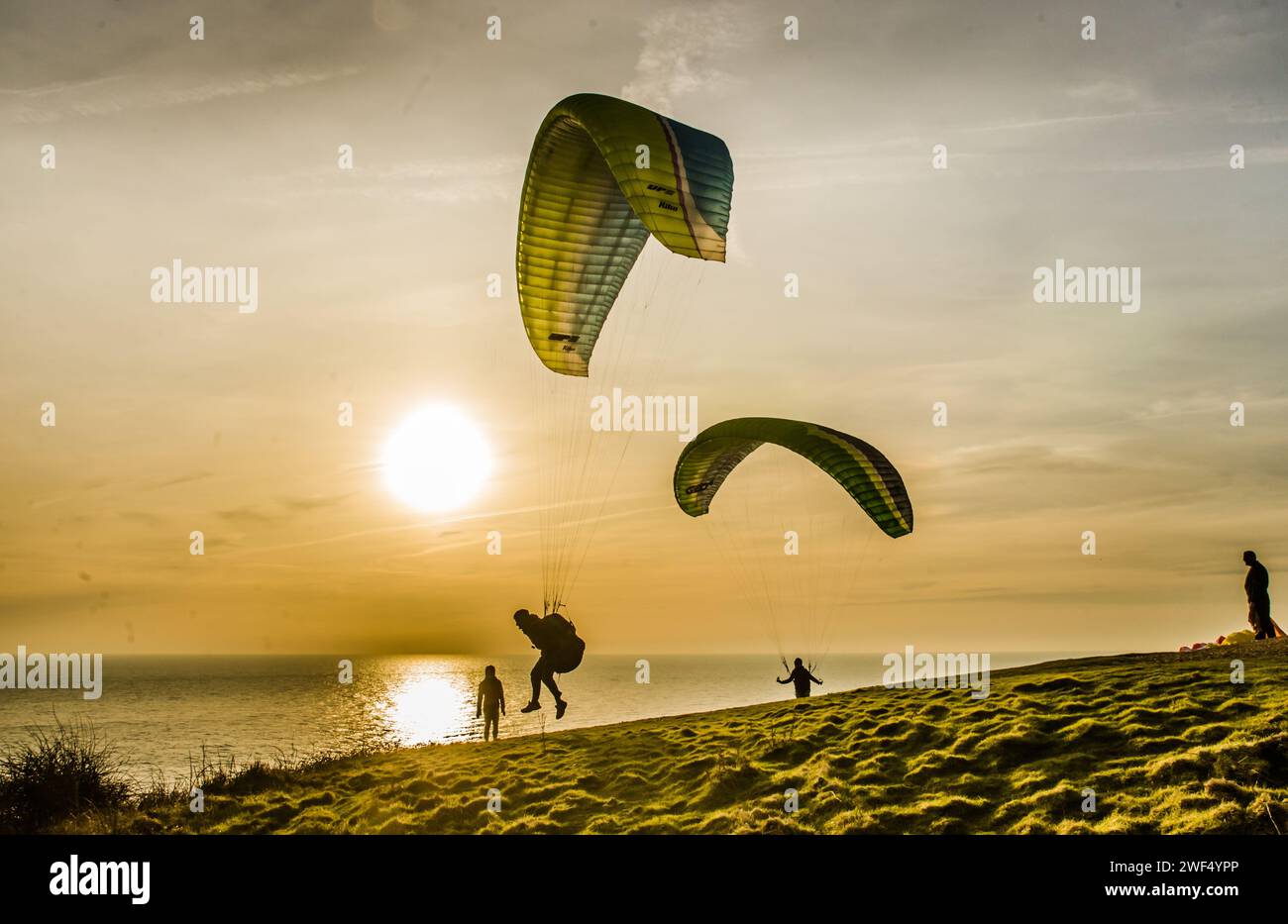 Newhaven. East Sussex, UK. 28th Jan, 2024. South Westerley wind brings paraglider pilots to the