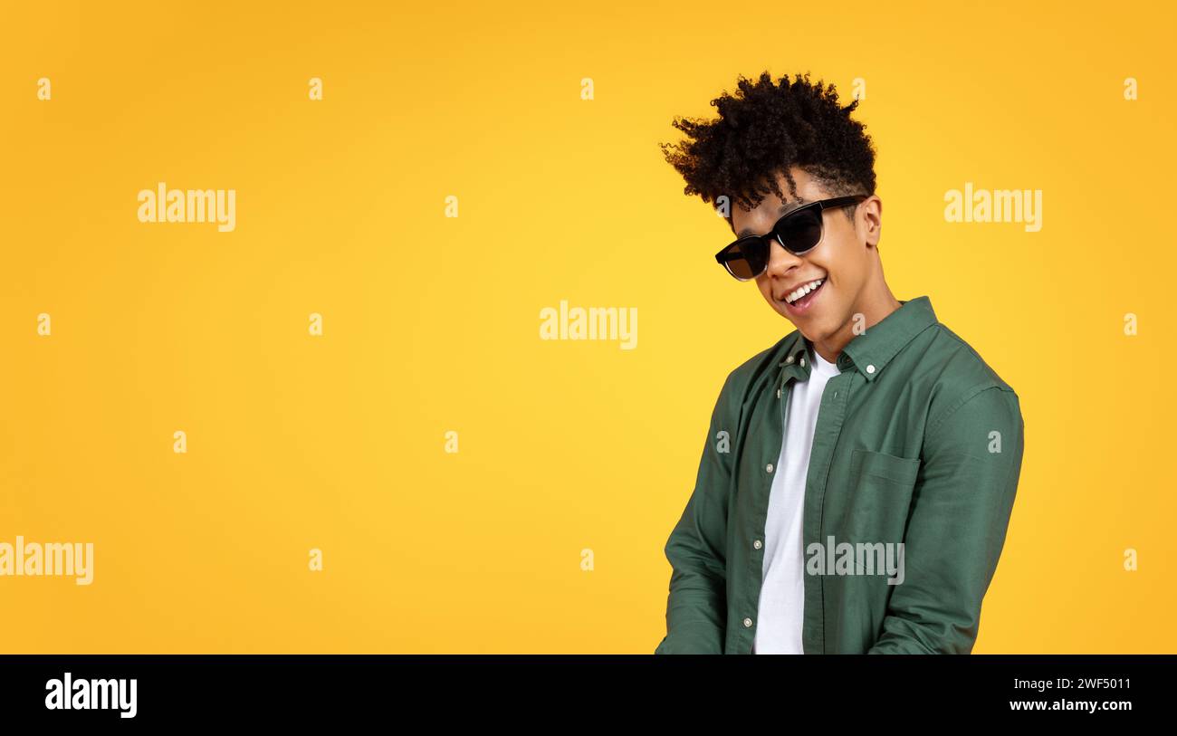 Stylish young african american guy wearing sunglasses Stock Photo
