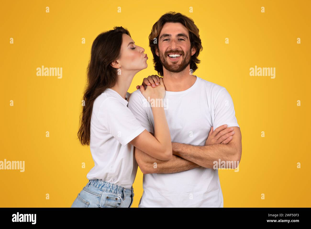 Guy kissing girlfriend on cheek hi-res stock photography and images - Alamy