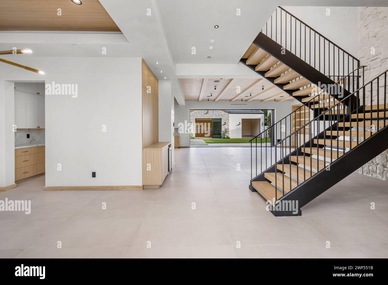 Wooden staircase leading to the second floor of a cozy home Stock Photo ...