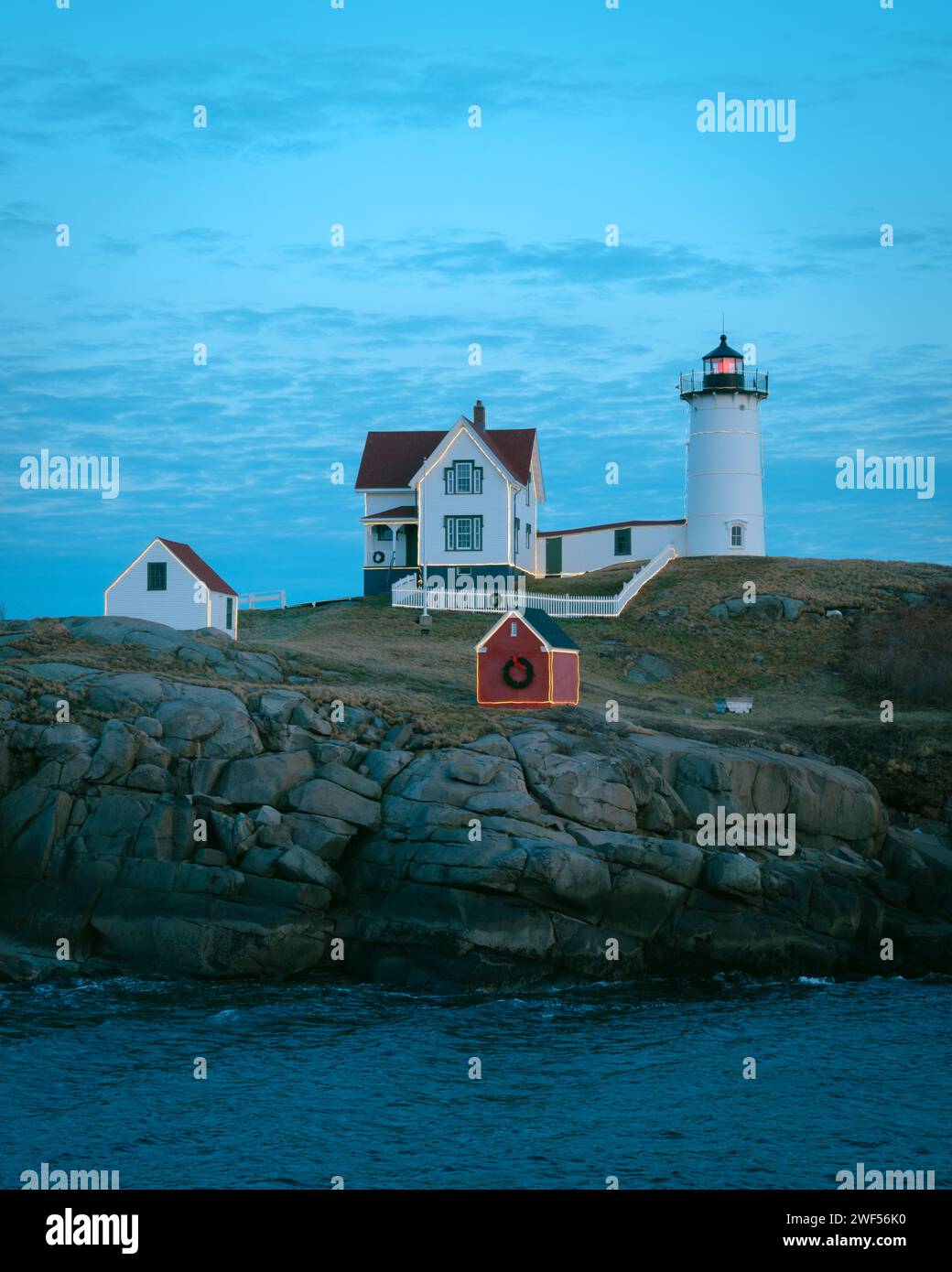 Nubble Lighthouse on a cloudy blue evening in York, Maine Stock Photo