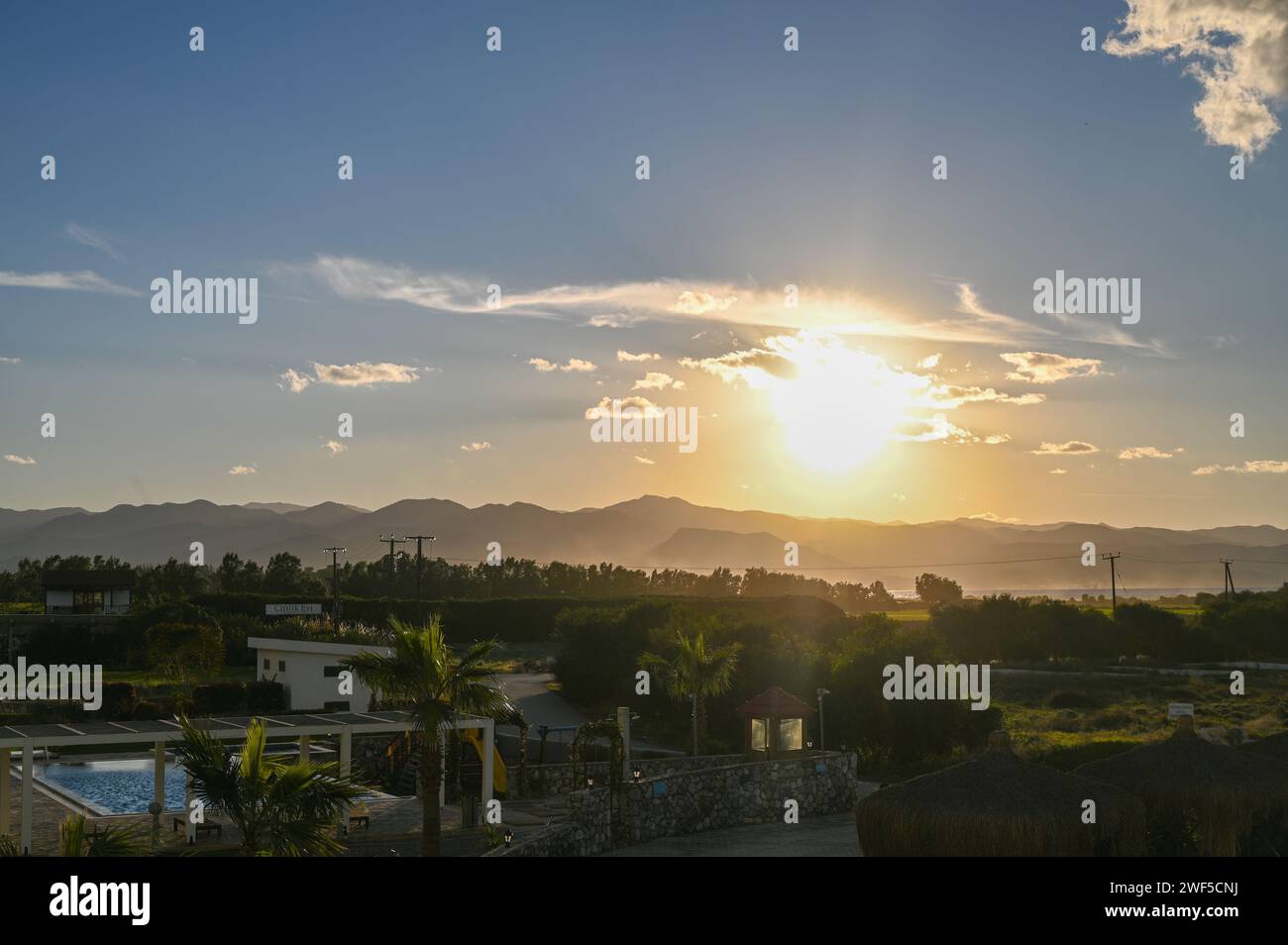 the sun sets behind the mountains in Cyprus 4 Stock Photo