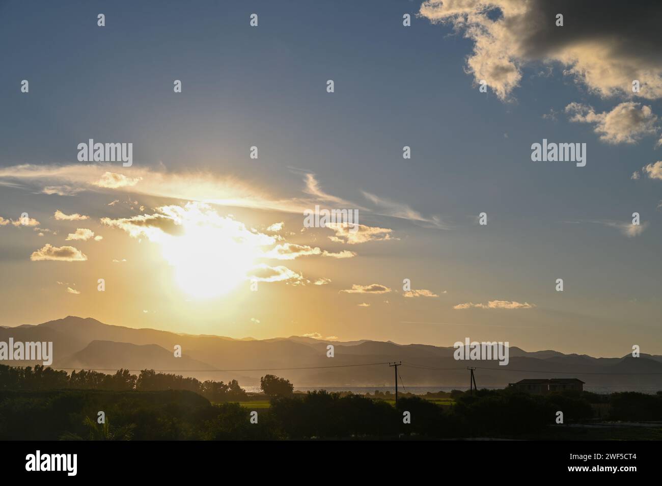 the sun sets behind the mountains in Cyprus 3 Stock Photo