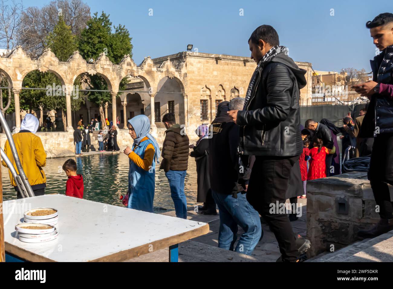 Tourists at Balıklıgöl (or Pool of Abraham, Halil-Ür Rahman Lake), is a pool in the southwest of the city center of Şanlıurfa, Turkey Stock Photo