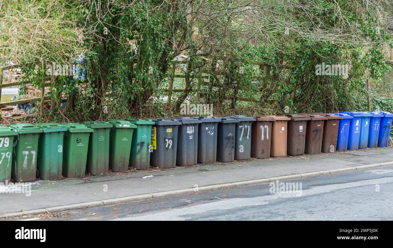 Wheelie Bins in a long line at the roadside waiting for collection Stock Photo Alamy