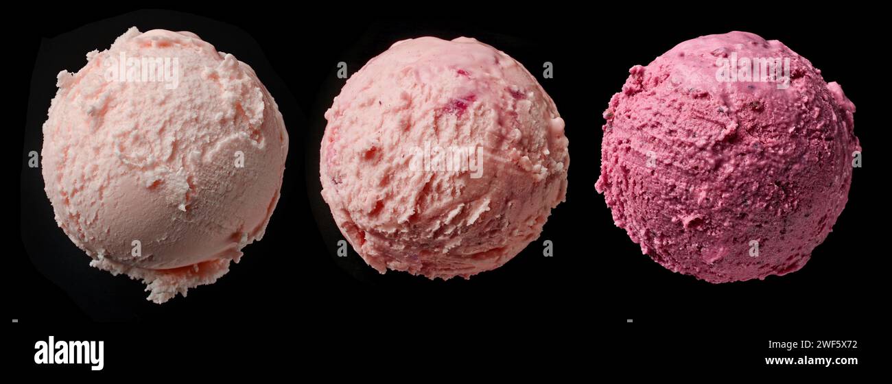 three different pink ice cream balls on black background, top view Stock Photo