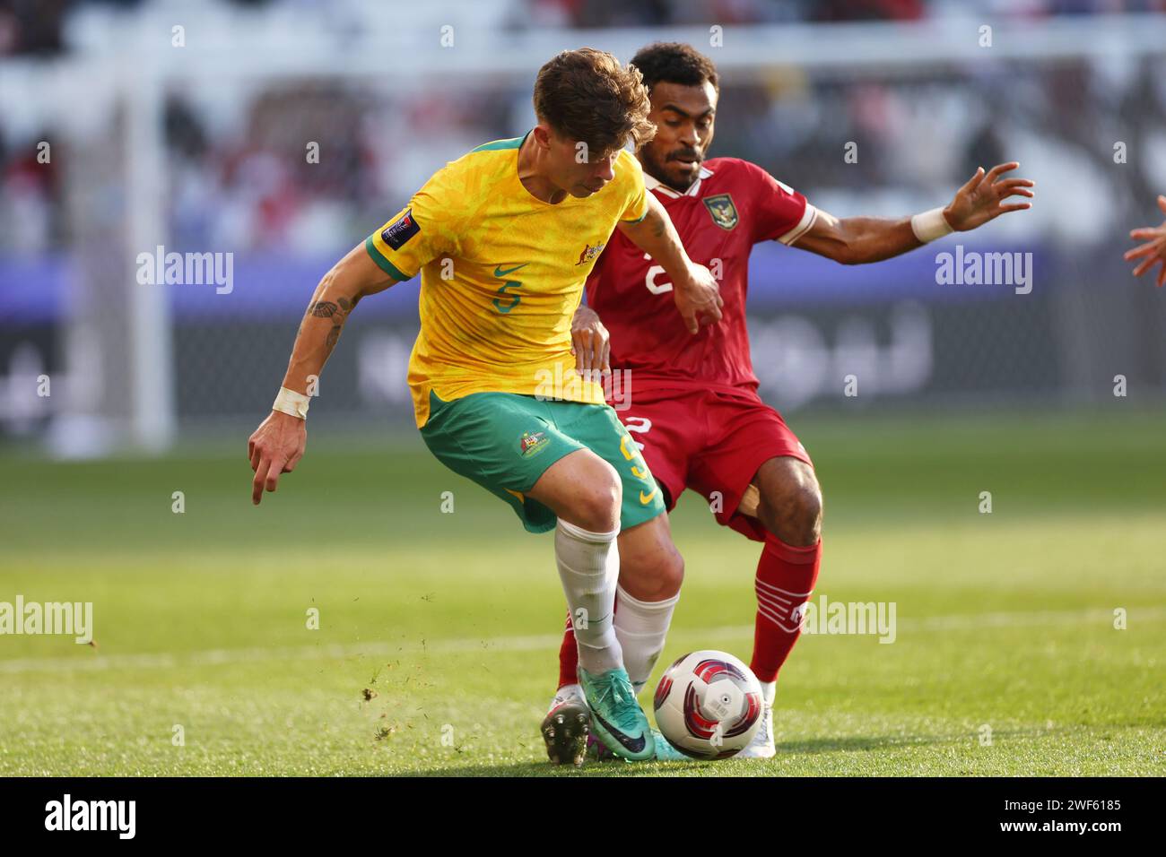 Doha, Qatar. 28th Jan, 2024. (L to R) Jordan Bos (AUS), Yakob Sayuri (INA) Football/Soccer : AFC Asian Cup Qatar 2023 quarter-final match between Australia 4-0 Indonesia at Jassim Bin Hamad Stadium in Doha, Qatar . Credit: Naoki Morita/AFLO SPORT/Alamy Live News Stock Photo