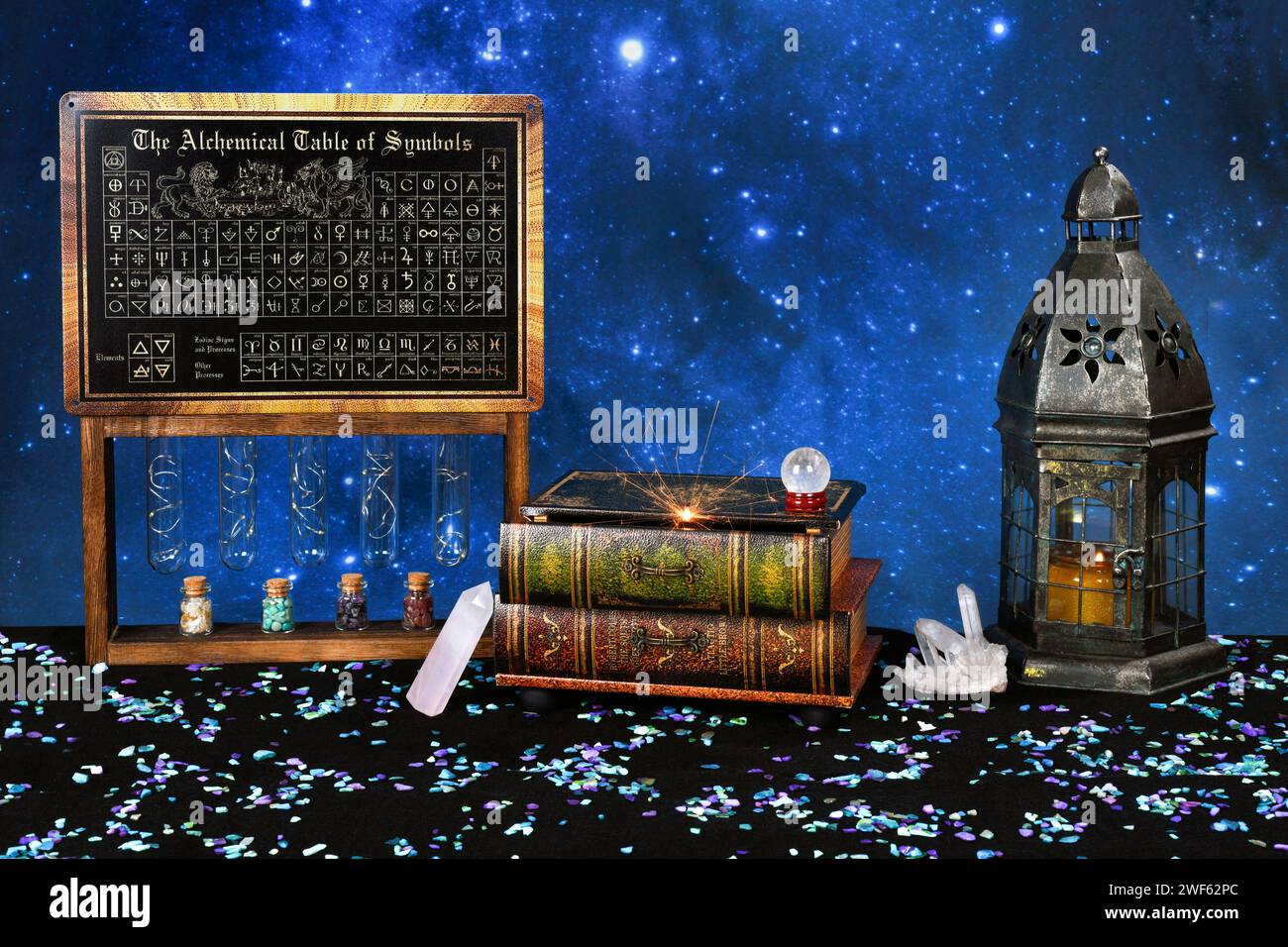 Alchemy chart of symbols stands next to sparks emitting from antique books as if a spell is being cast. Stock Photo