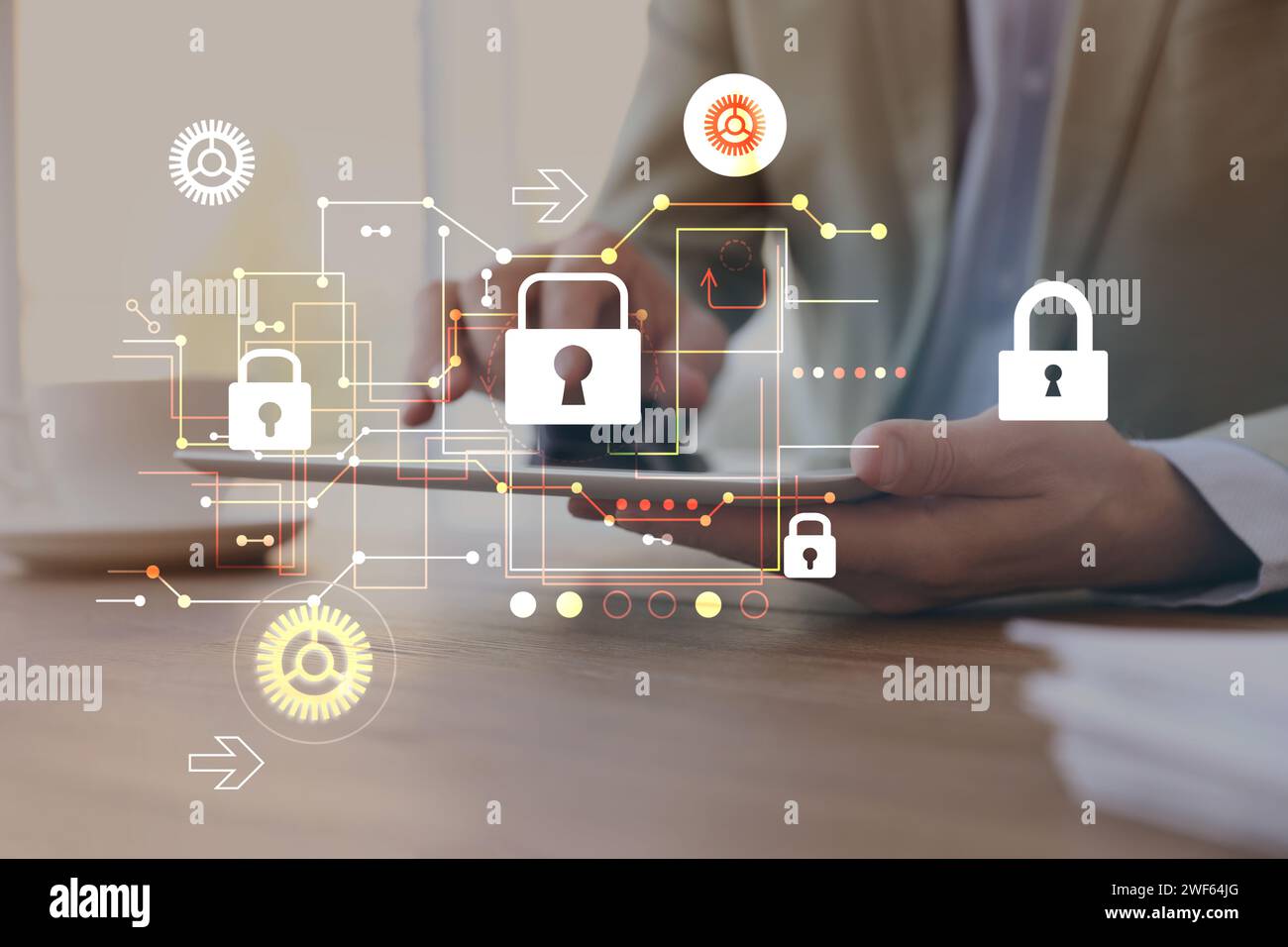 Privacy protection. Man using tablet at table, closeup. Digital scheme with padlocks over device Stock Photo